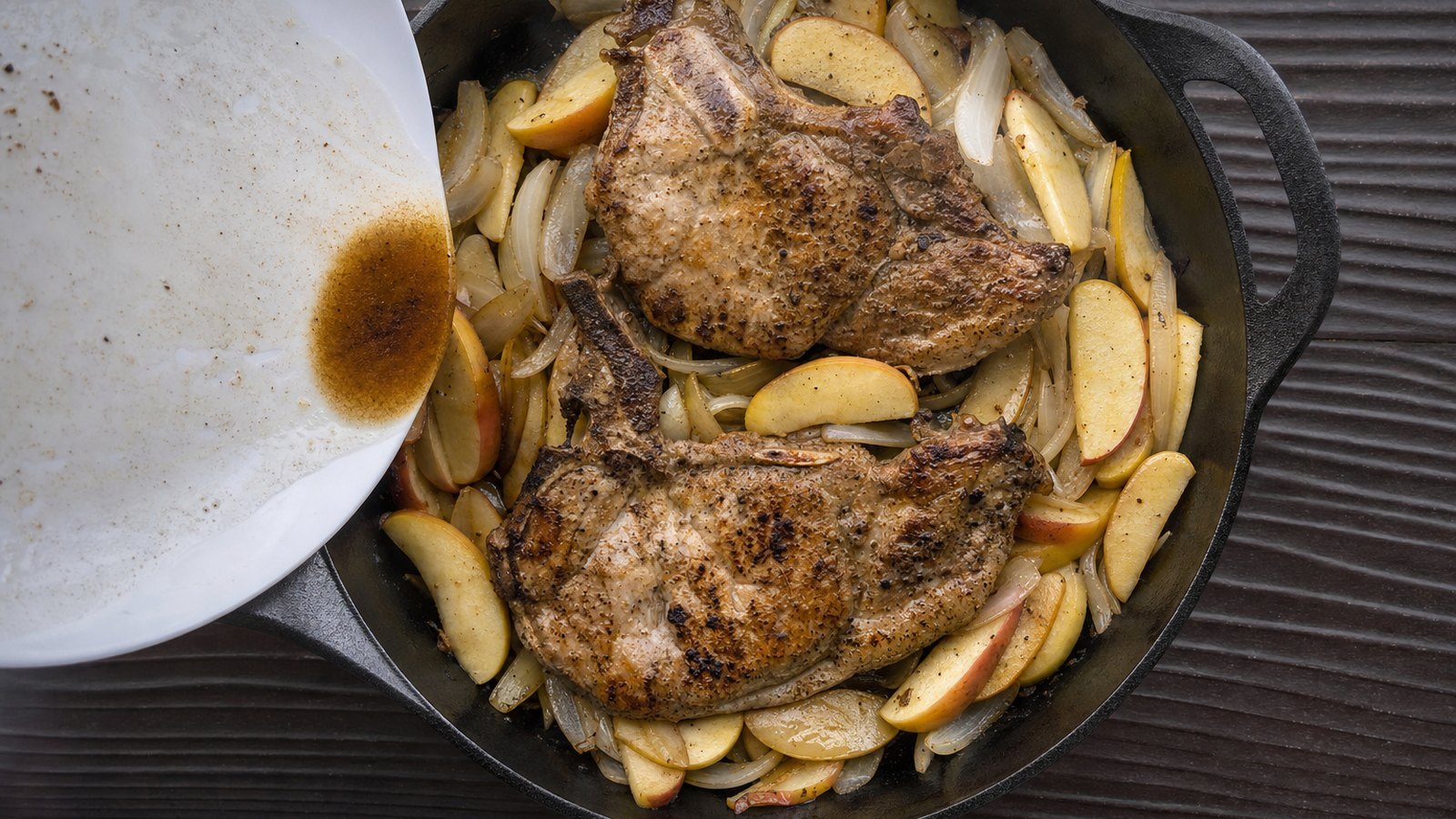 Baked Pork Chops with Apples and Onions: Nestle the chops on top of the apples and onions and pour in any juices from the plate