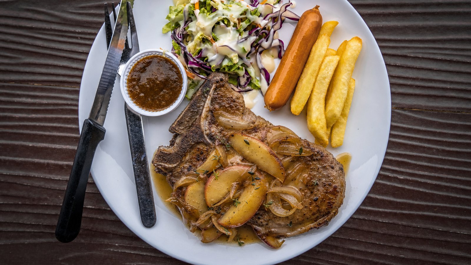 Baked Pork Chops with Apples and Onions, plated and ready to serve