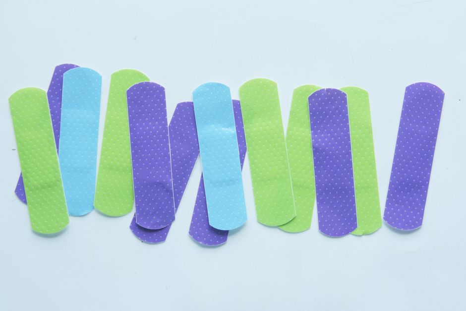 A row of colorful bandages, the simple purse essential that can save you an unnecessary trip home.