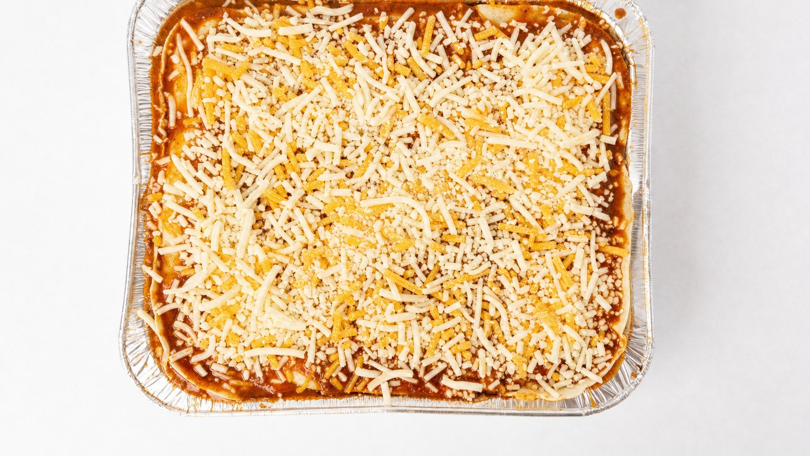 Chicken Enchilada Casserole: Add 4 more tortillas, the remaining filling and another 1 cup of cheese. Top with the last 4 tortillas, pour t