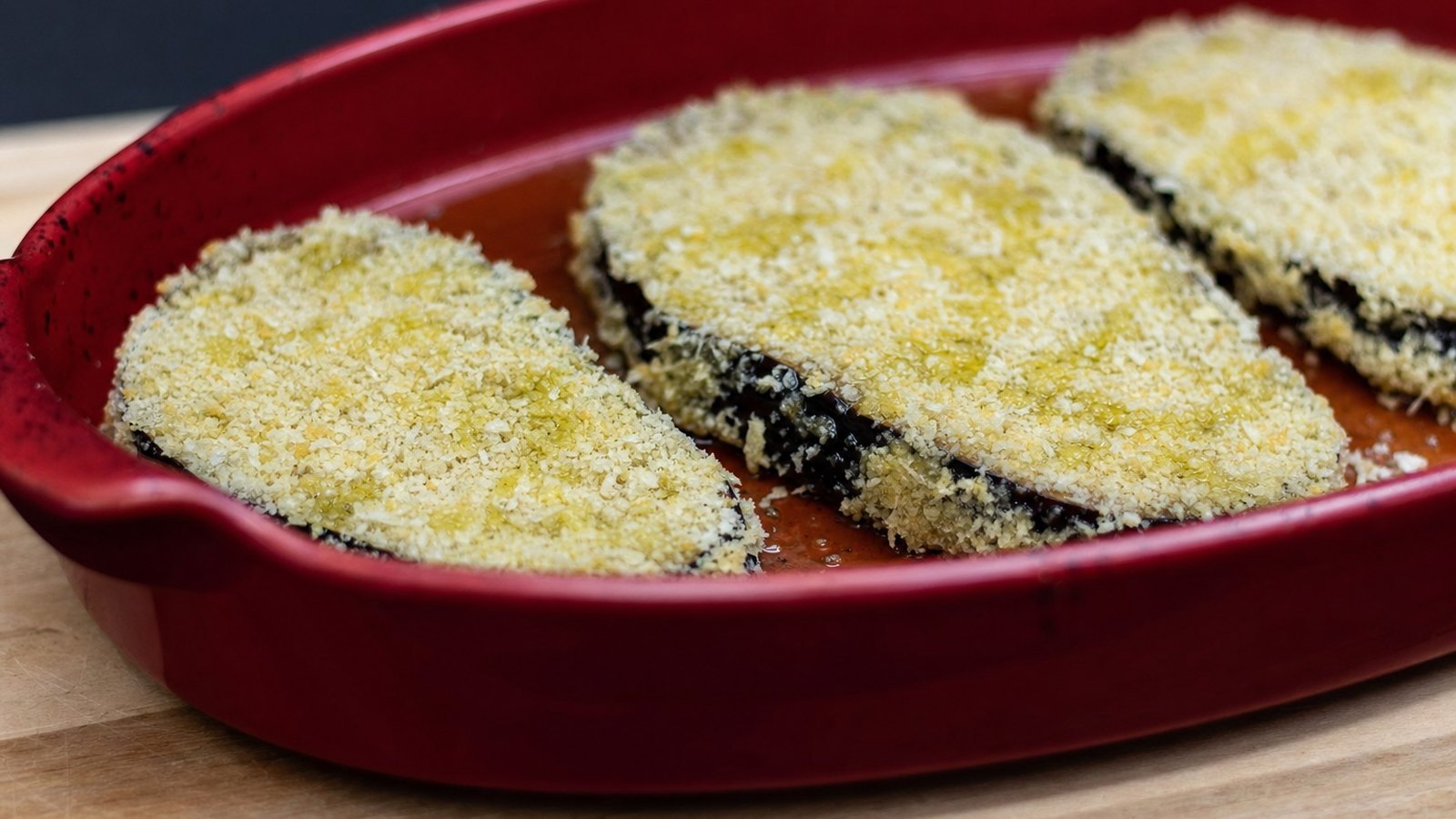 Eggplant Parmesan: Dredge each slice in flour, dip in egg and press firmly into the panko on both sides. Arrange in a single laye