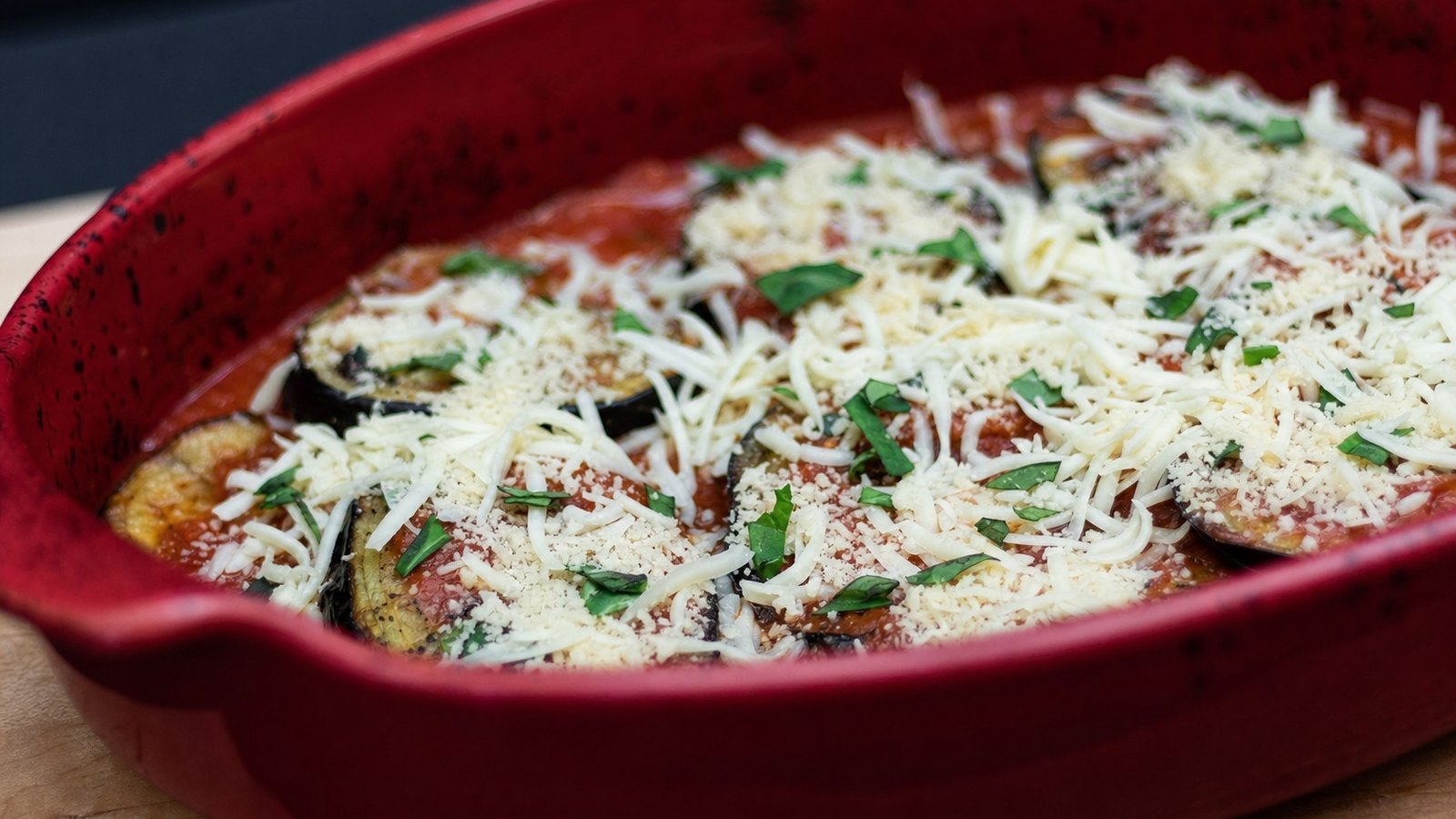 Eggplant Parmesan: Reduce the oven to 375°F. Spread 3/4 cup marinara in a 9 by 13 inch baking dish. Add a layer of eggplant, then