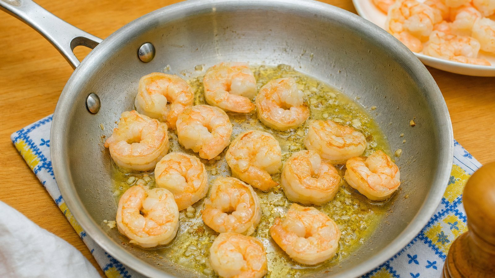 Garlic Butter Shrimp Pasta: Heat the olive oil and 1 tbsp butter in a 12 inch skillet over medium high heat. Add the shrimp in a single la