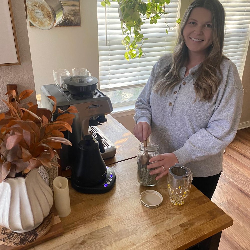 Isabel making tea at her kitchen counter