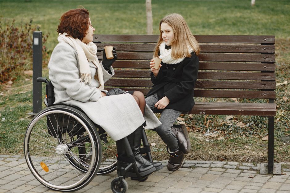 A daughter sits down with her mother for a heartfelt conversation in the park, the kind of quiet moment perfect for asking about tougher times in life.