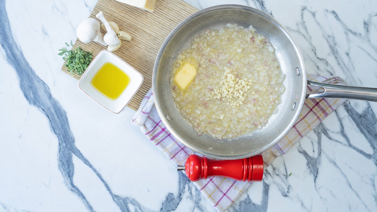 Mushroom Risotto: Reduce the heat to medium. Add 1 tbsp butter and the shallot with a pinch of salt and cook 3 minutes until sof