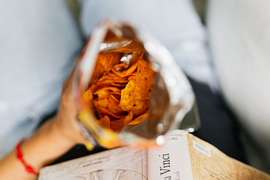 Keeping a bag of chips handy while reading, a simple habit that prevents snack-time meltdowns.