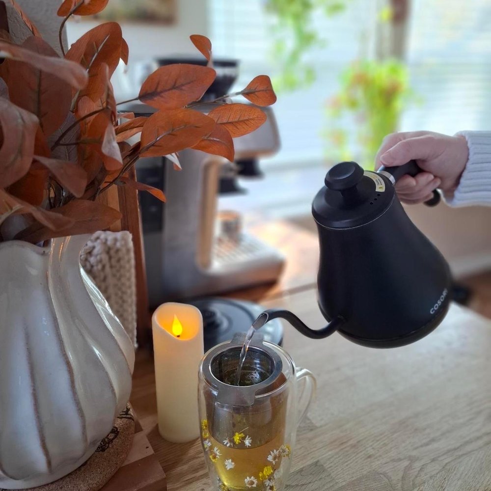 Pouring hot water over loose leaf tea