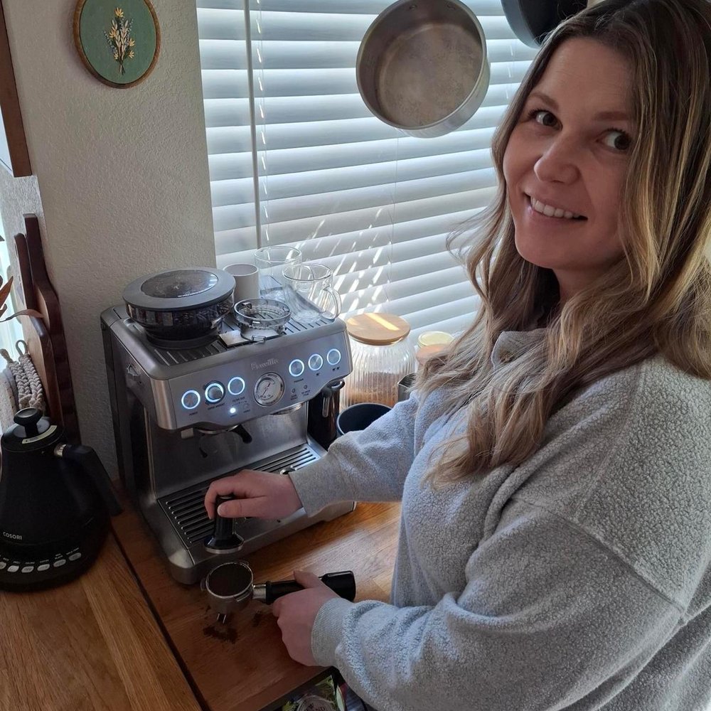 Isabel pulling an espresso shot at home