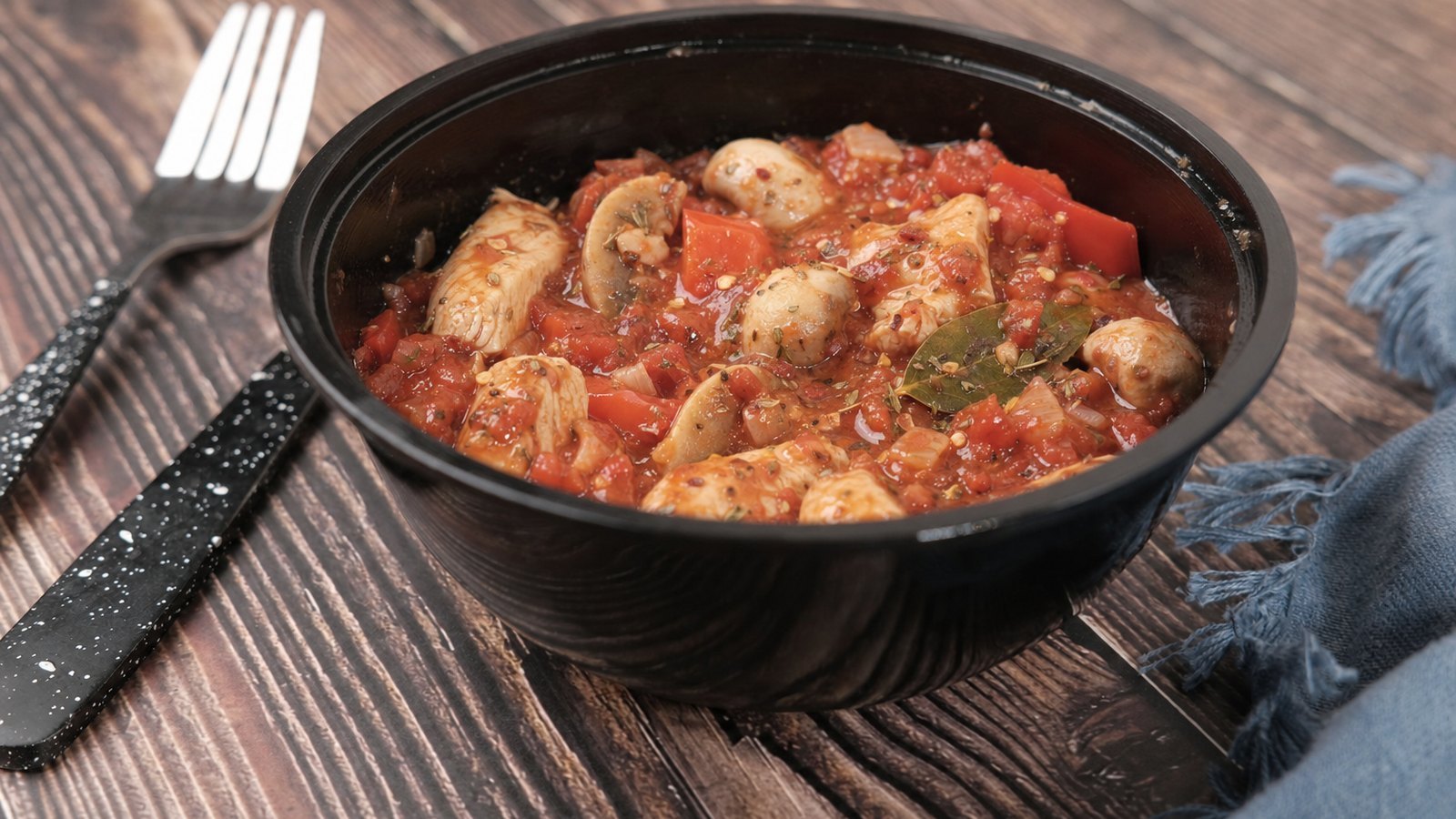 Slow Cooker Chicken Cacciatore: Spoon the vegetable mixture over the chicken. Add the mushrooms, crushed tomatoes, oregano, thyme, bay leaf an