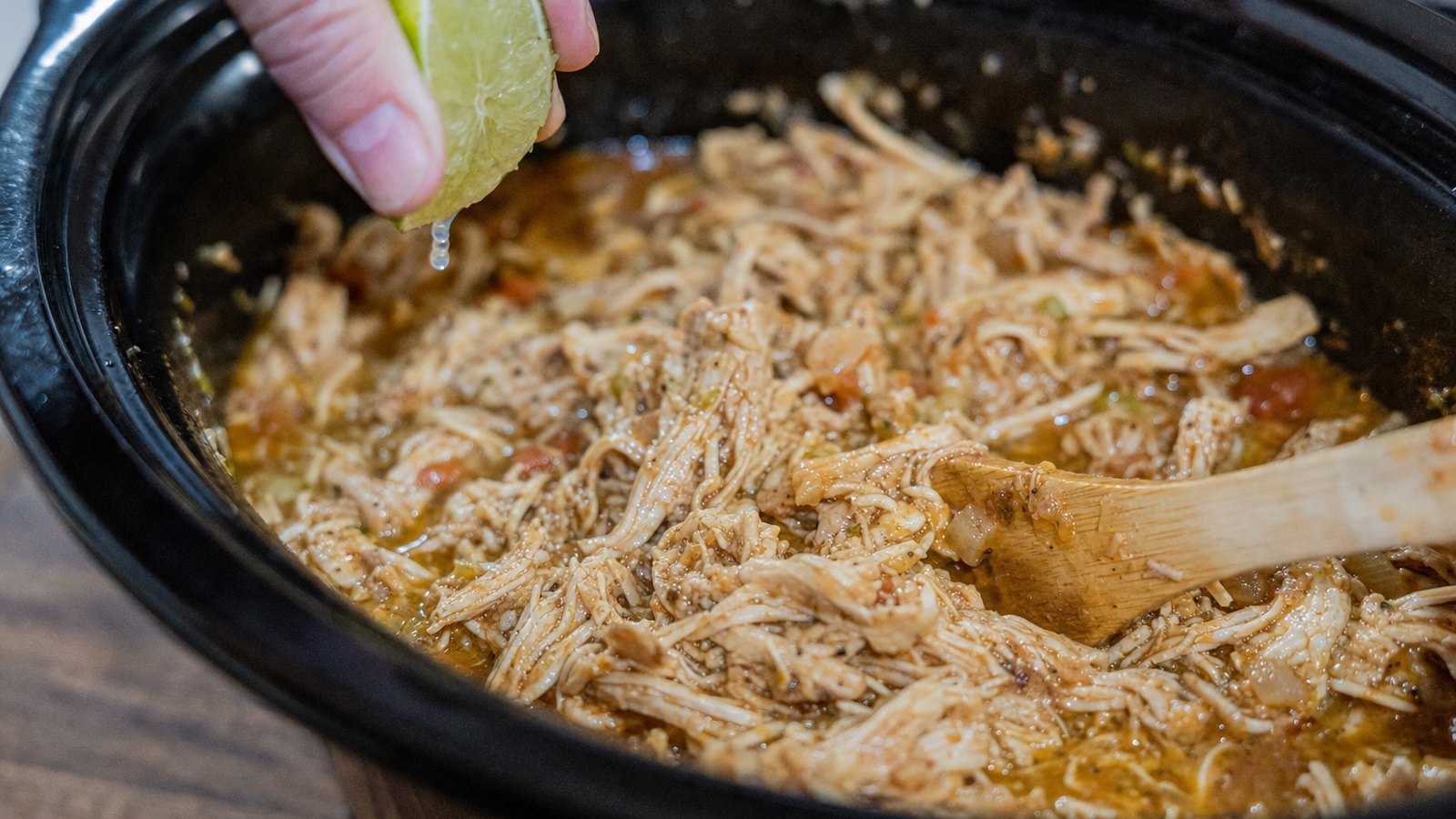 Slow Cooker Chicken Tacos: Return the shredded chicken to the juices and stir. Add the juice of the second lime. Taste and add salt if ne