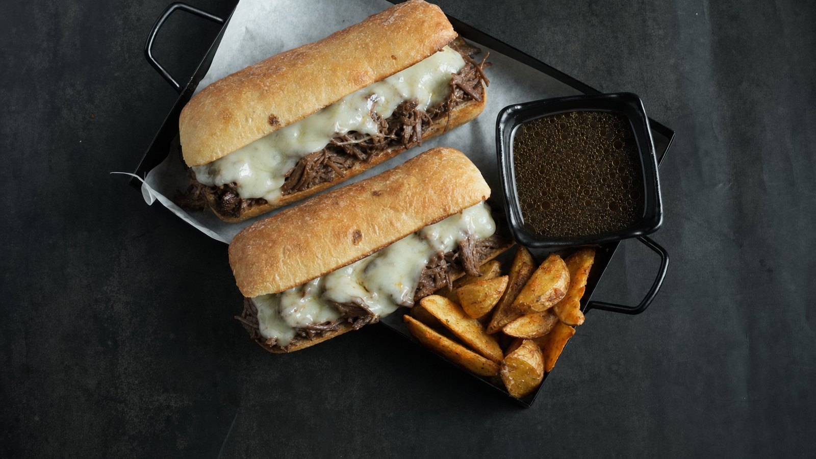 Slow Cooker French Dip Sandwiches, plated and ready to serve