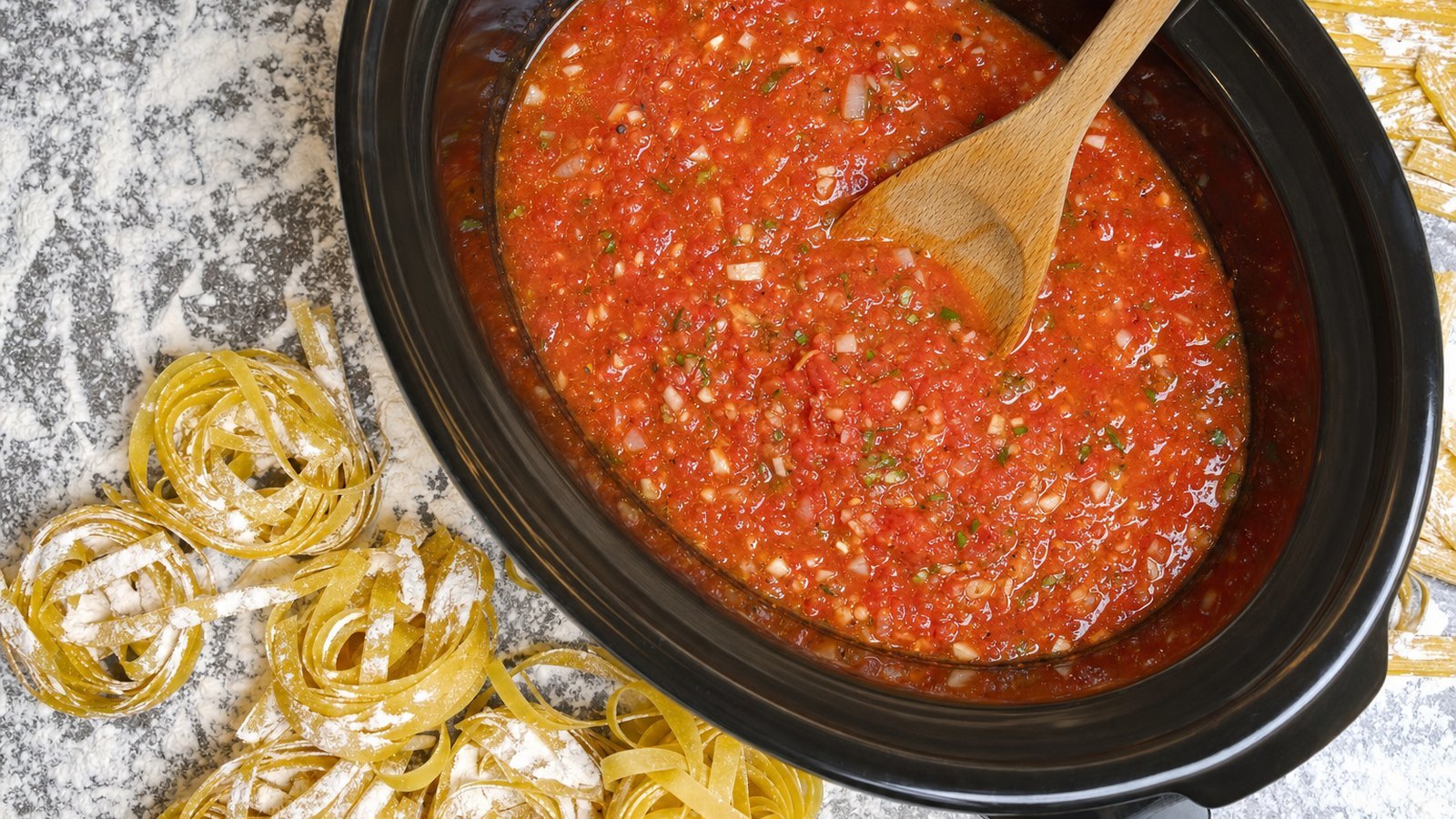 Slow Cooker Meatballs in Marinara: Meanwhile, stir the crushed tomatoes, olive oil, onion, garlic, basil, oregano, sugar and salt together in a 6
