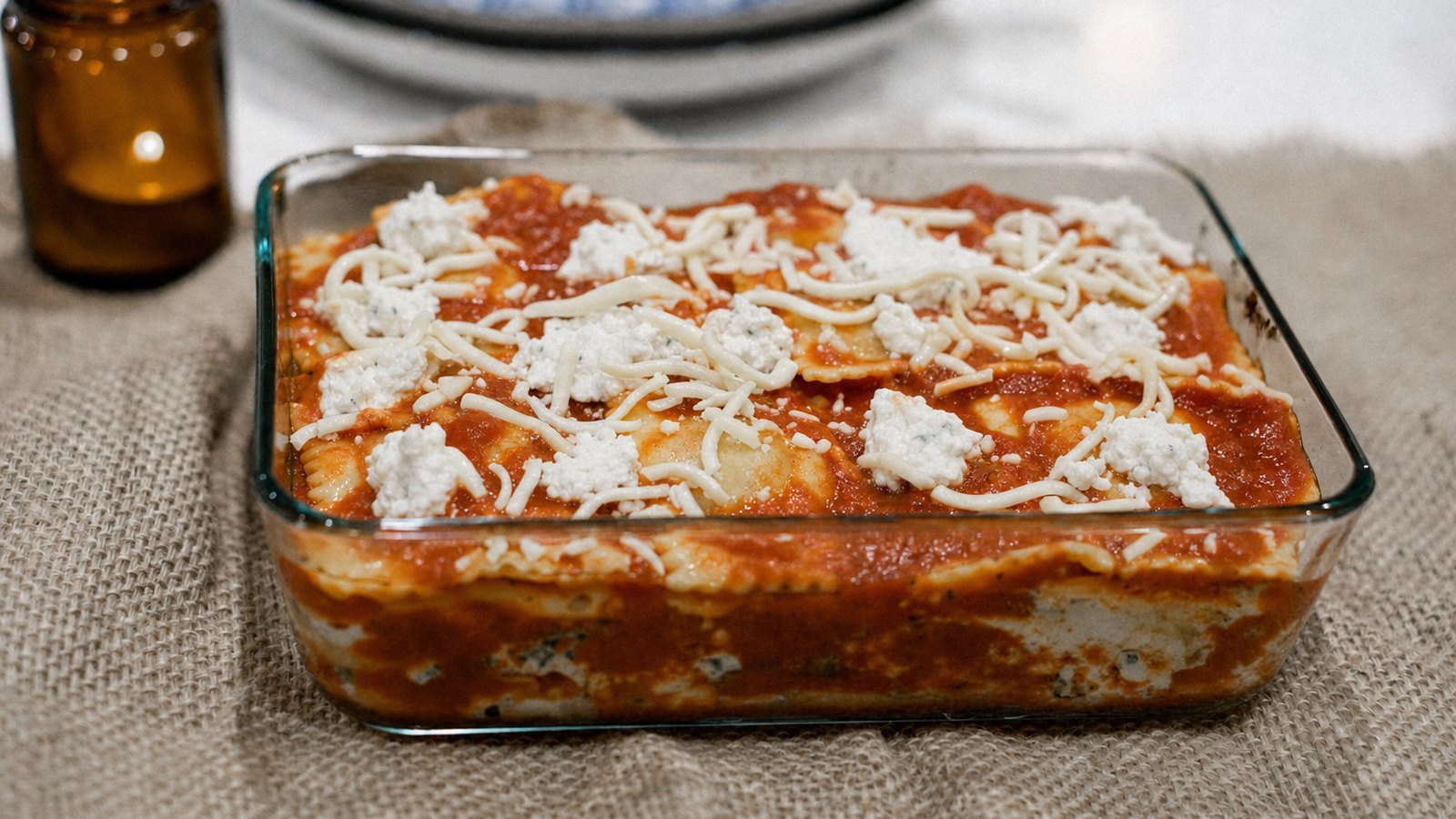 Slow Cooker Ravioli Lasagna: Add another 1 1/2 cups of sauce, another third of the ravioli, the remaining ricotta and 1 cup of mozzarella.