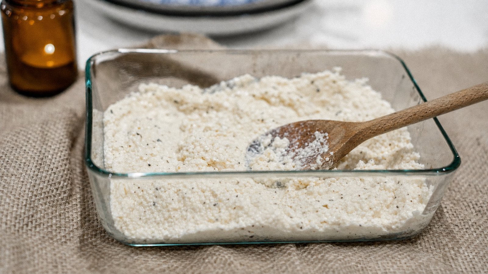 Slow Cooker Ravioli Lasagna: In a bowl, stir the ricotta, egg, Parmesan, salt and pepper until smooth
