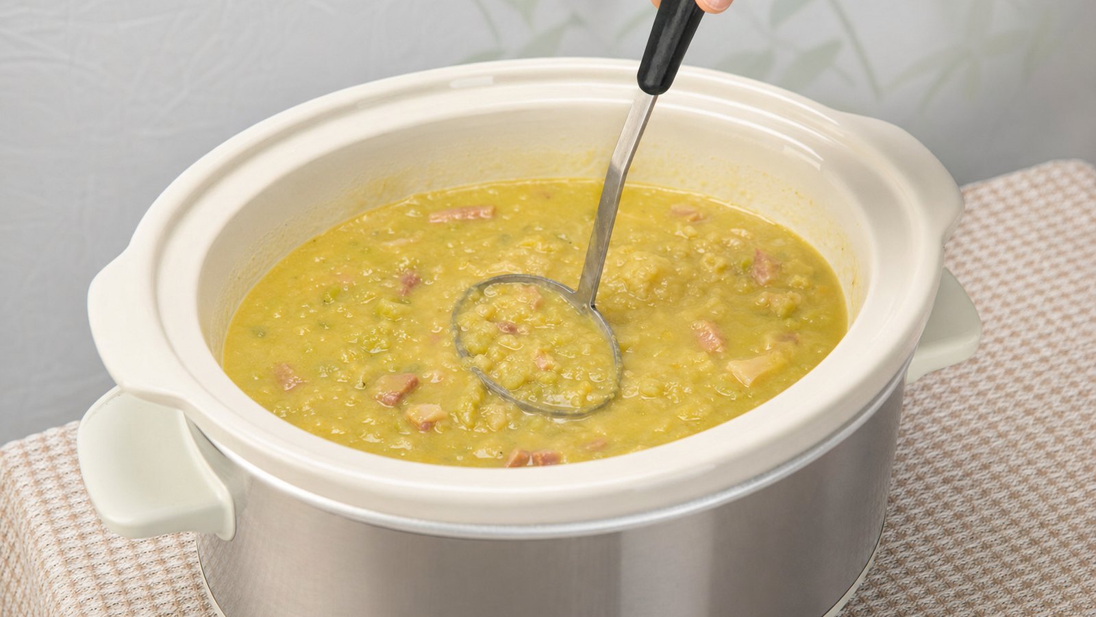 Slow Cooker Split Pea Soup with Ham: Stir the soup well. Mash with a potato masher or pulse briefly with an immersion blender for a smoother textur